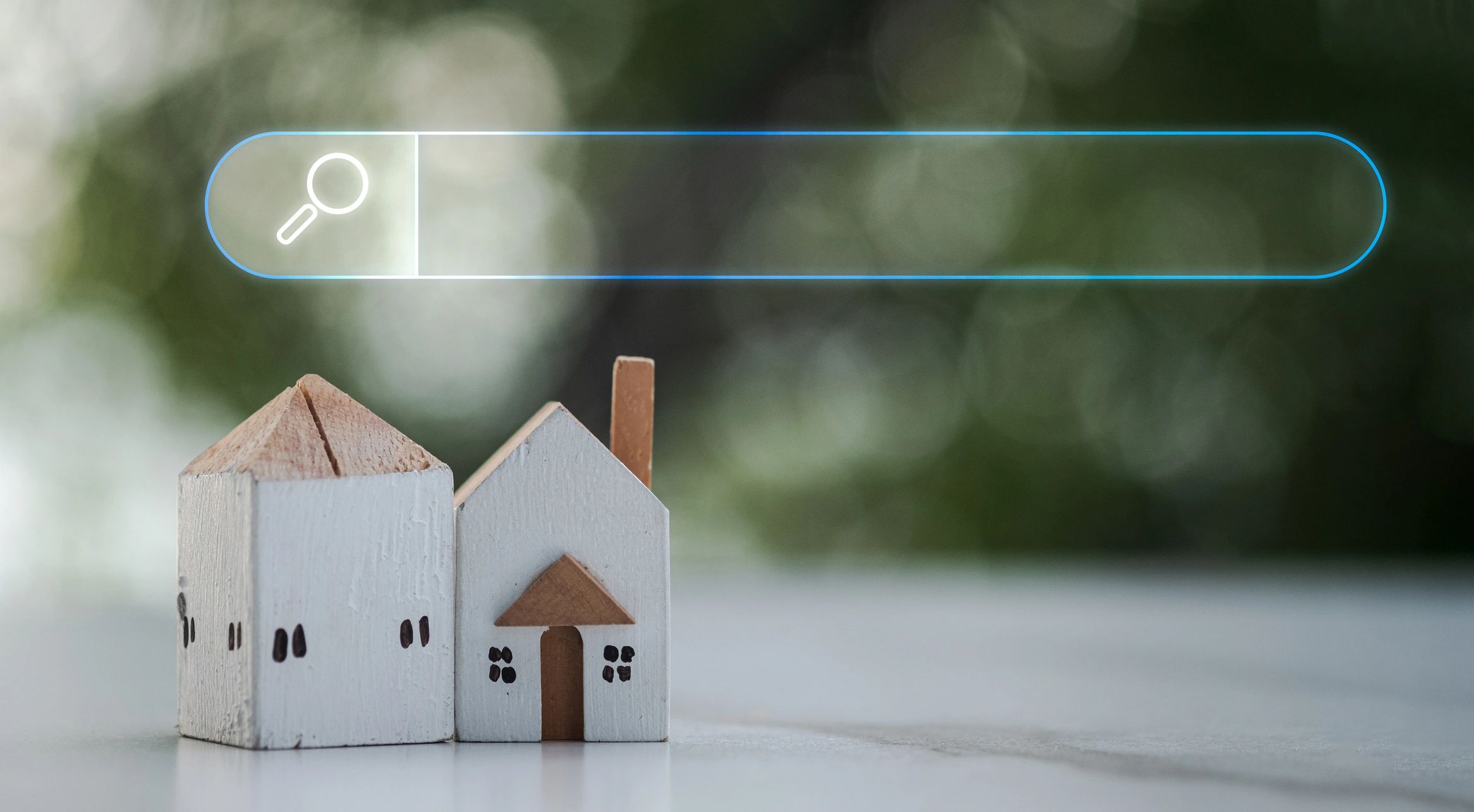 Searching tool bar above model wood home, symbolizing property search